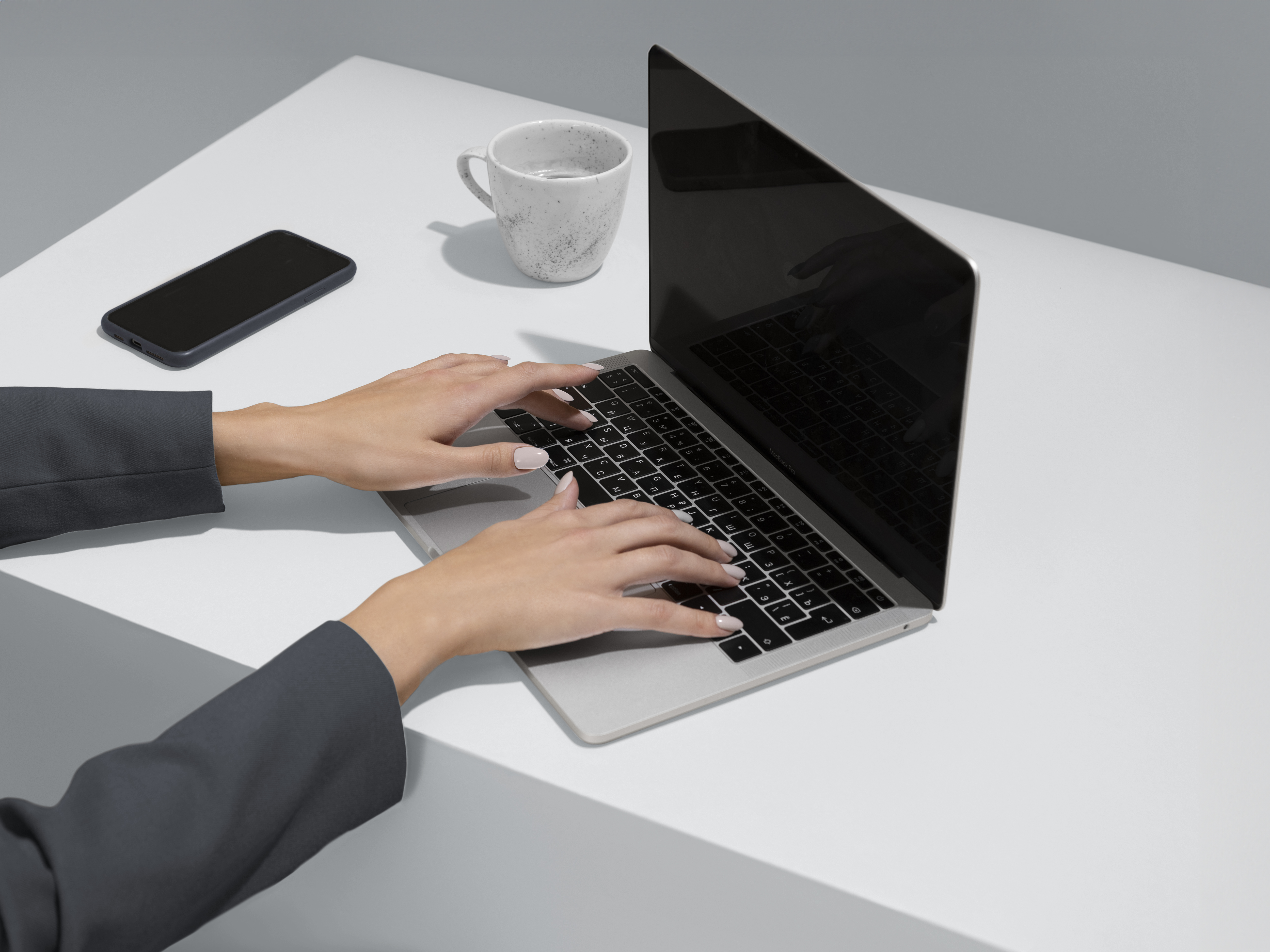 Eye-level view of a person analyzing marketing data on a laptop