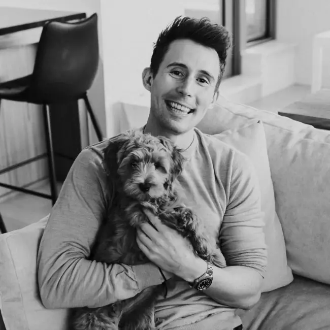 Thomas Robinson, founder of DirectToGrowth Co., with his dog